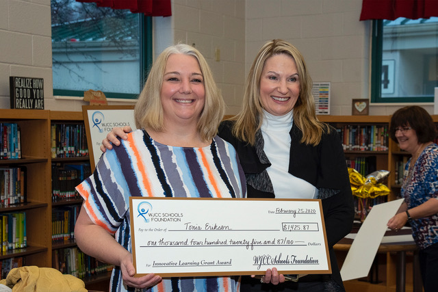 Penny Pulley presenting teacher with grant